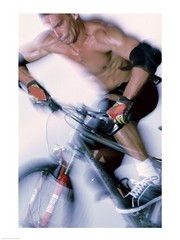 Close-up of a young man riding a bicycle - Art Print | Poster Prints from Posterazzi