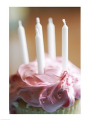 Close-up of a pink frosted cupcake with white unlit candles 18.00 x 24.00 Poster Print