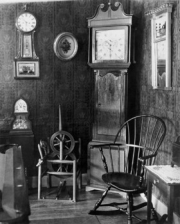 Antique clocks in a living room 18.00 x 24.00 Poster Print