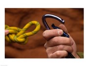Close-up of human hands holding a carabiner and rope - Art Print | Poster Prints from Posterazzi